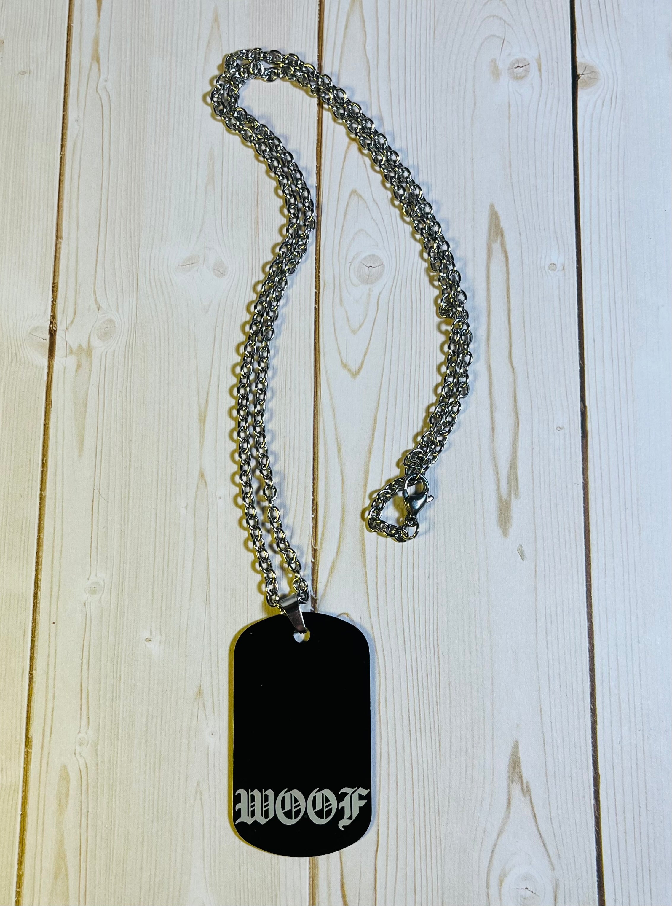 WOOF Old English dog tag.